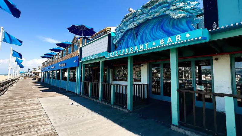 Storefronts along the Santa Monica Pier boardwalk, a CRG brokerage assignment
