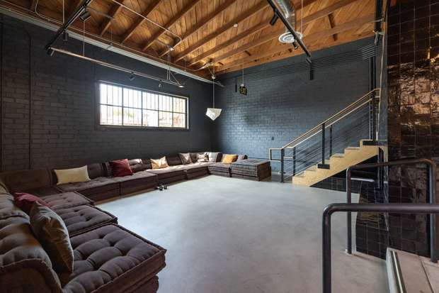 The same space, lounge and screening room after build-out
